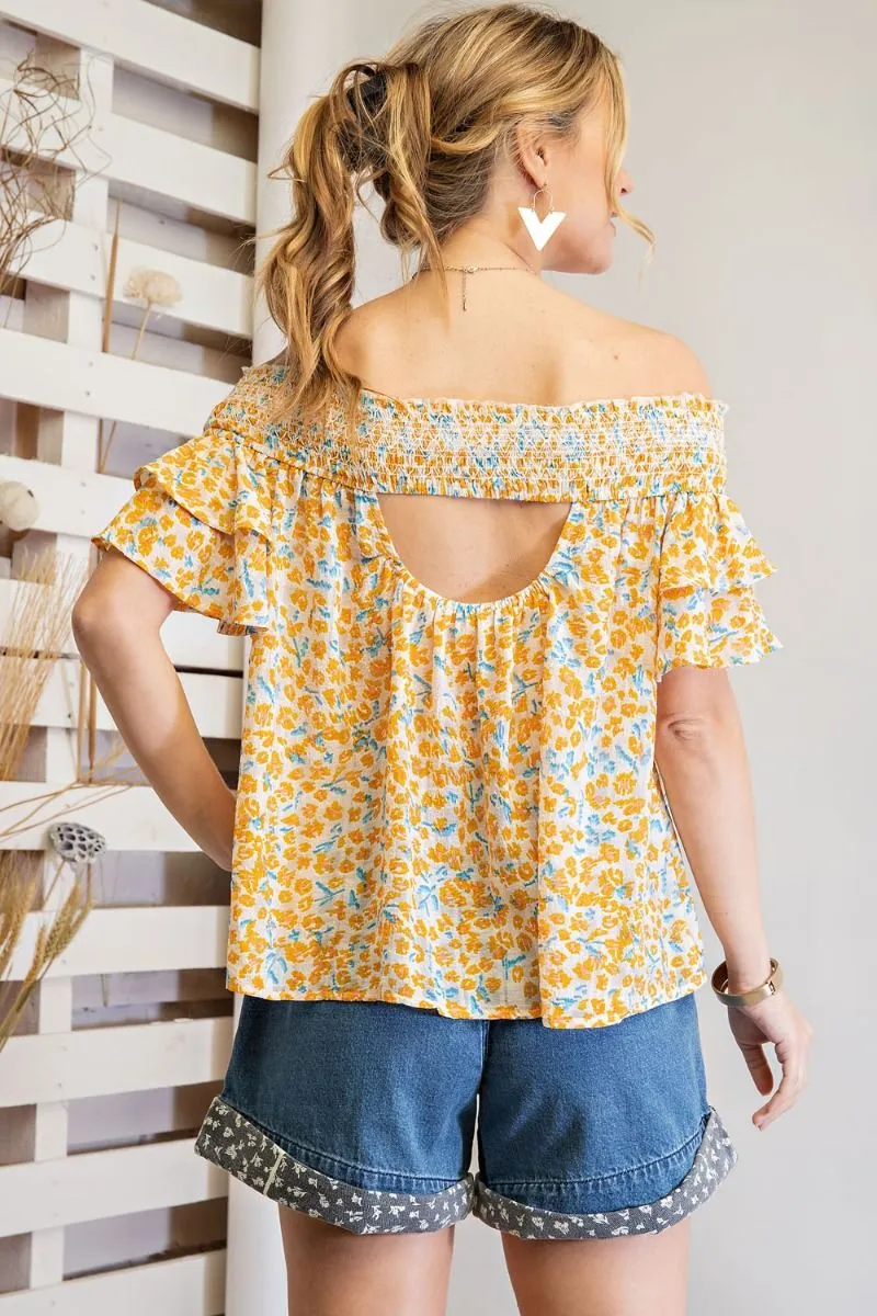 Off shoulder loose fit top with ruffled sleeves and smocked neckline